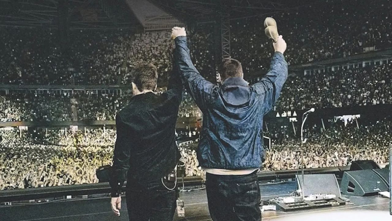 Liam and Noel Gallagher on stage